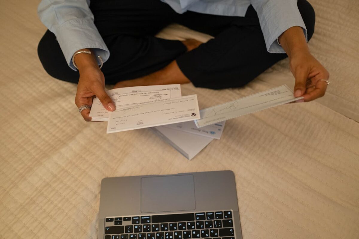 photo-of-a-person-s-hands-holding-cheques