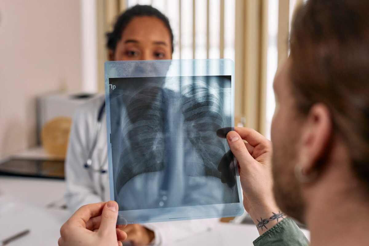 a-man-holding-an-x-ray-result-