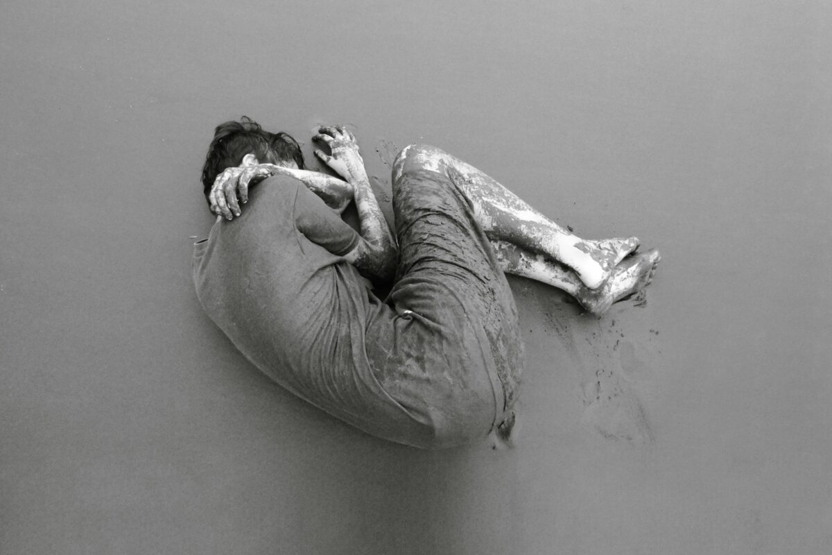 7 Weird Reasons Some People Secretly Enjoy Relationship Drama 4 black-and-white-image-of-mud-covered-person