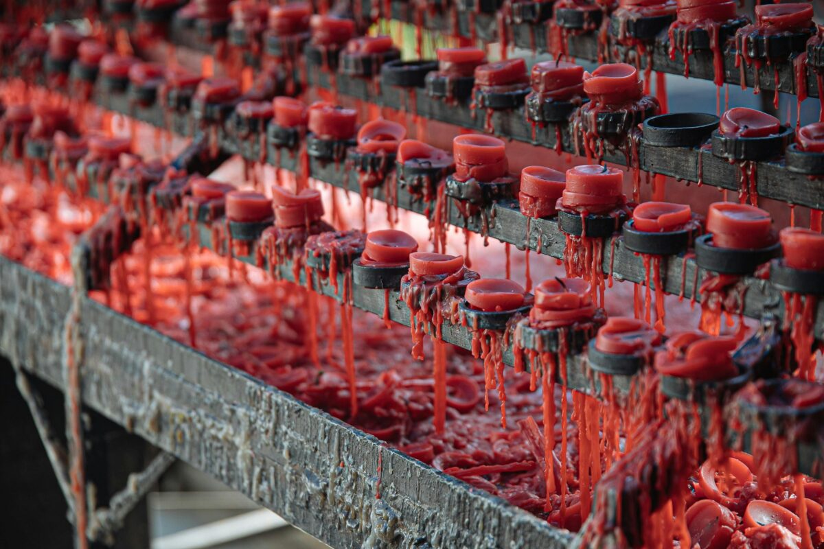 red-candles melting-on-shelves