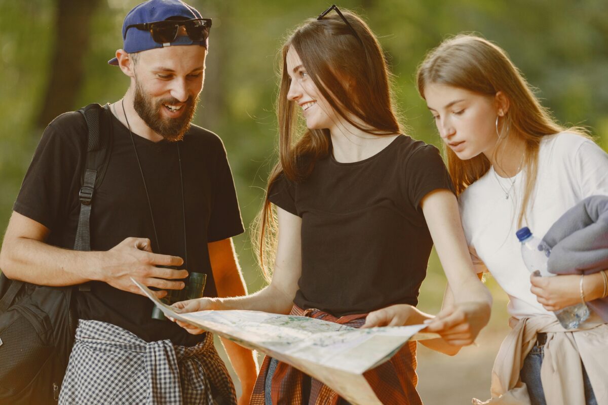 a-woman-looking-at-the-man-while-holding-a-map