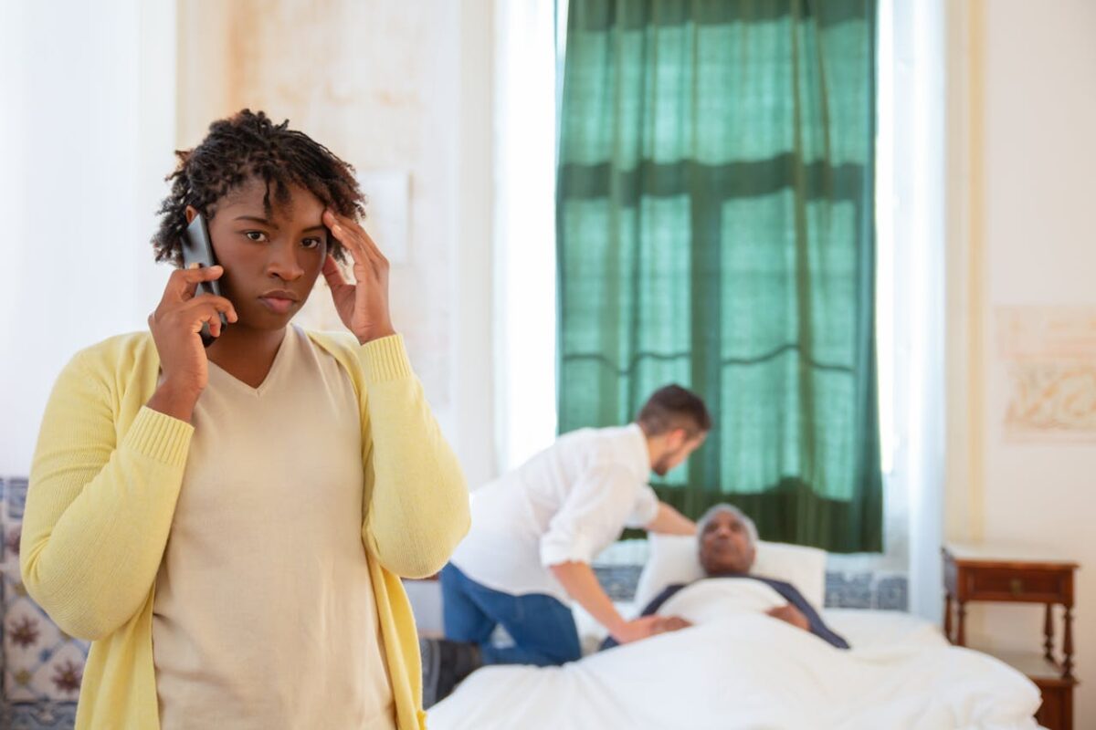woman-in-yellow-long-sleeve-shirt-holding-black-mobile-phone-
