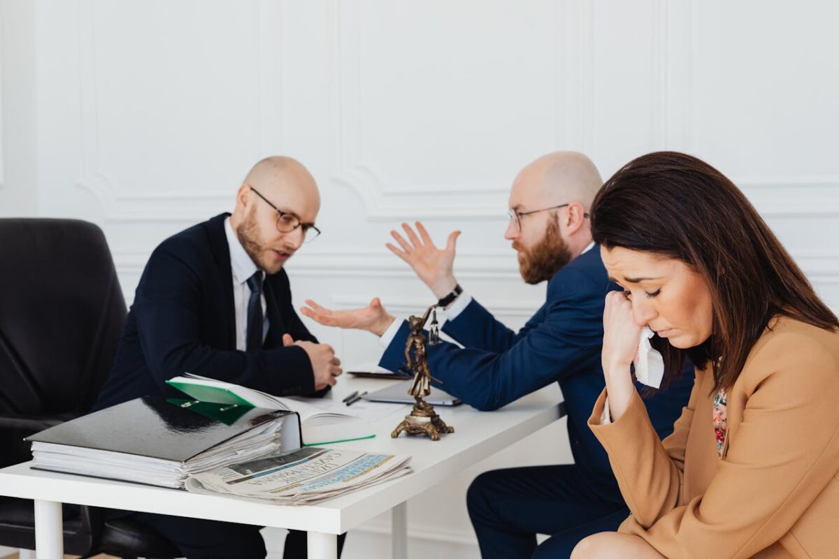 /sad-woman-sitting-beside-the-bearded-man-in-blue-blazer-