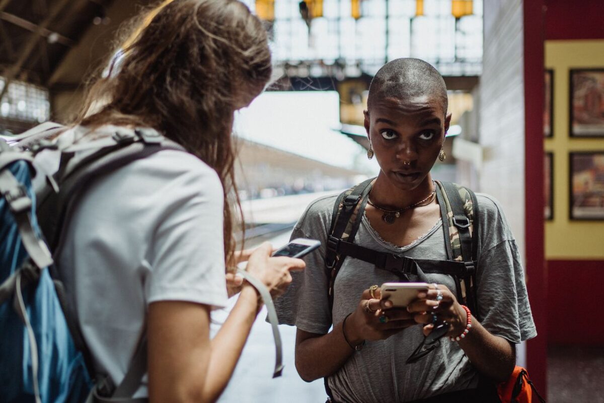woman-in-gray-shirt-holding-a-smartphone-