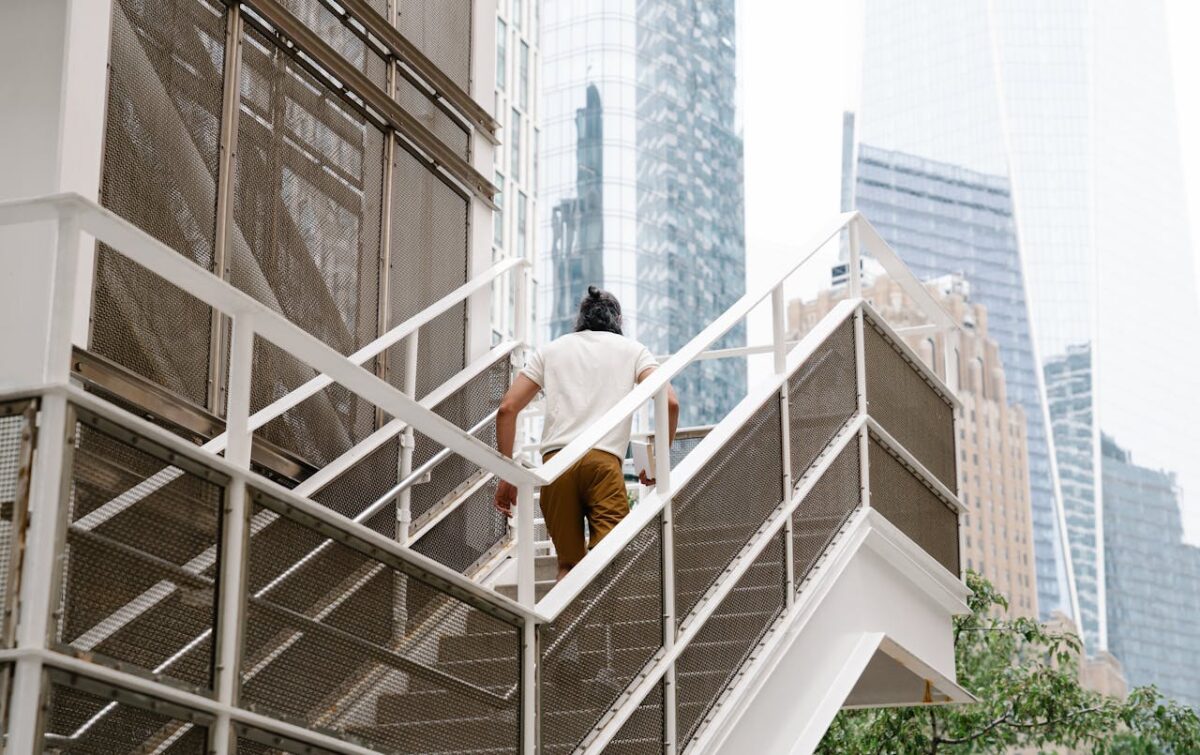 8 Retirement Curse Traps That Can Quietly Ruin the Life You Worked For 3 /person-going-up-using-staircase-