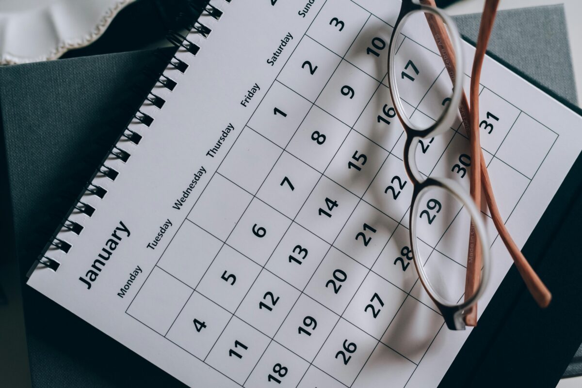 brown-framed-eyeglasses-on-a-calendar