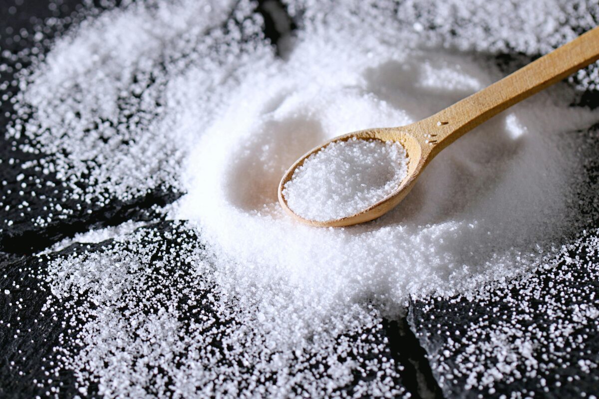 close-up-shot-of-a-wooden-spoon-and-salt
