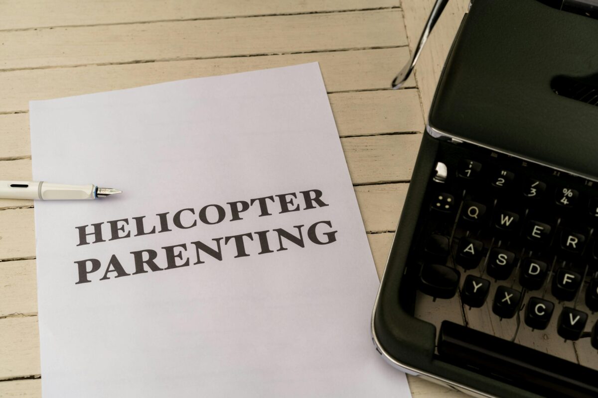  a-typewriter-with-the-words-helicopter-parenting-on-it