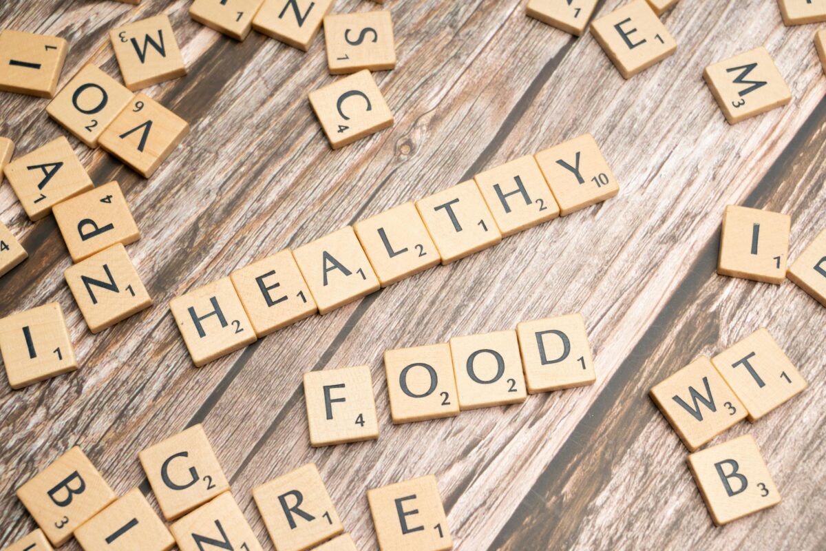 healthy-food-on-wooden-table-with-scrabble-letters