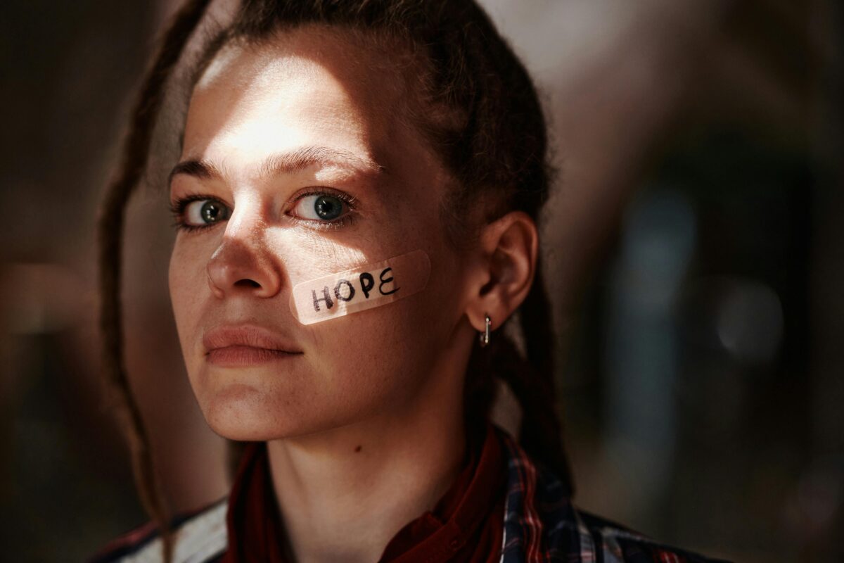 close-up-photo-of-a-woman-with-band-air-on-her-face
