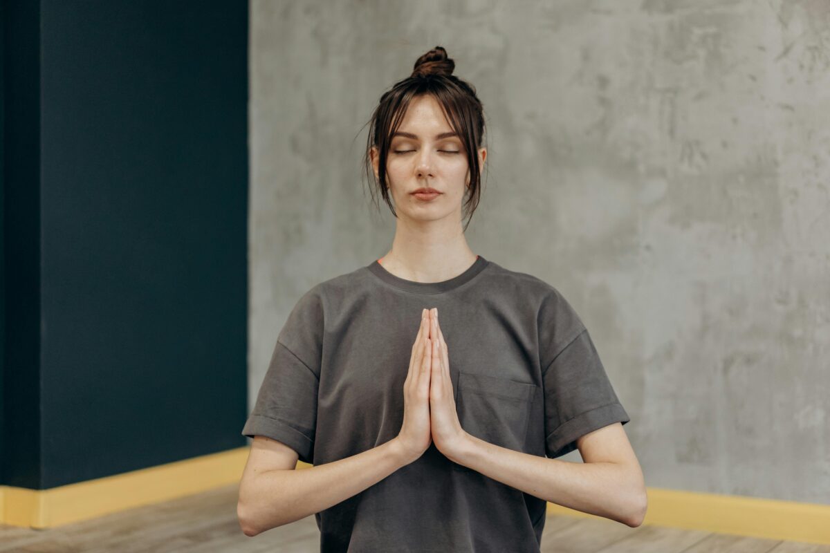 woman-in-black-crew-neck-t-shirt-in-a-lotus-position