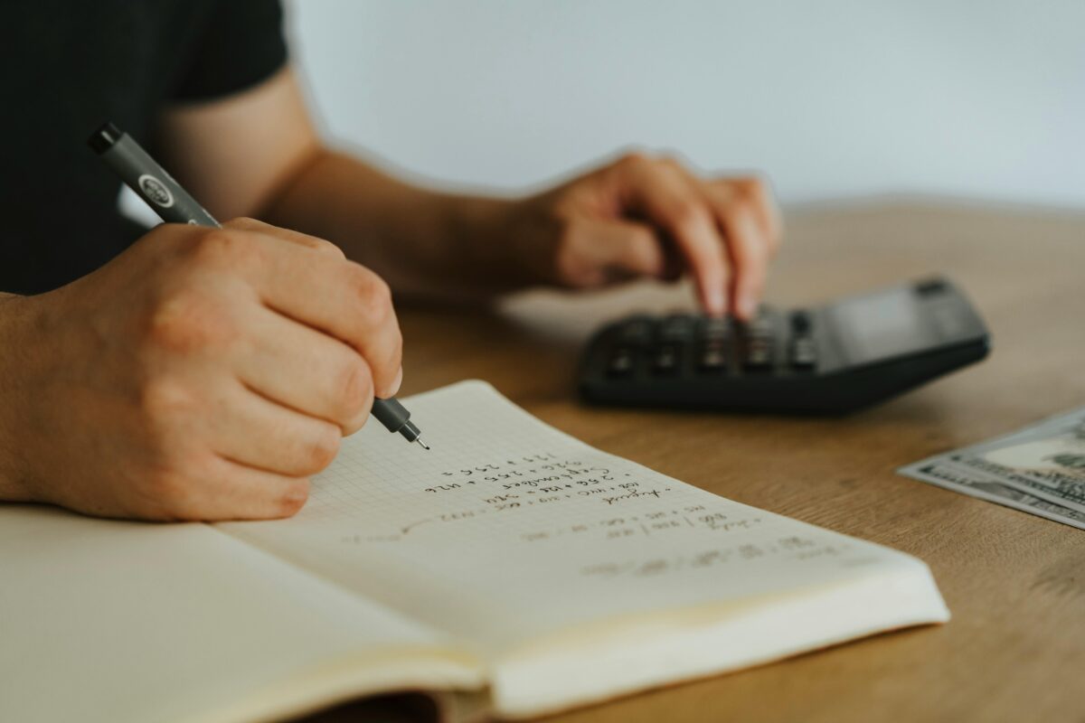 8 Childhood Money Habits That Are Suppressing Your Finances Today 4 a-person-writing-on-white-notebook