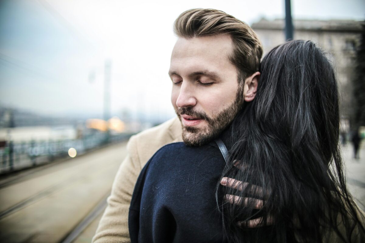 selective-focus-back-view-photo-of-woman-hugging-man