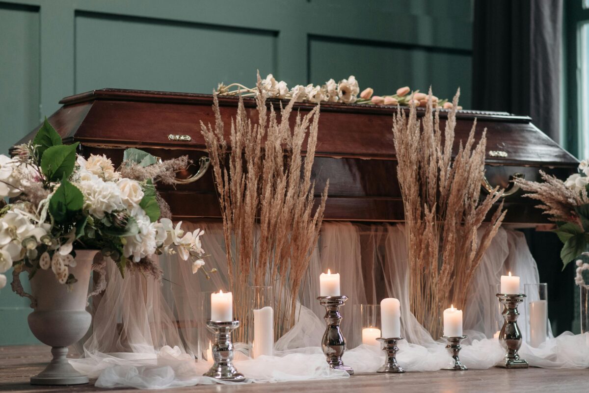 Candles and flowers-near-the-wooden-coffin