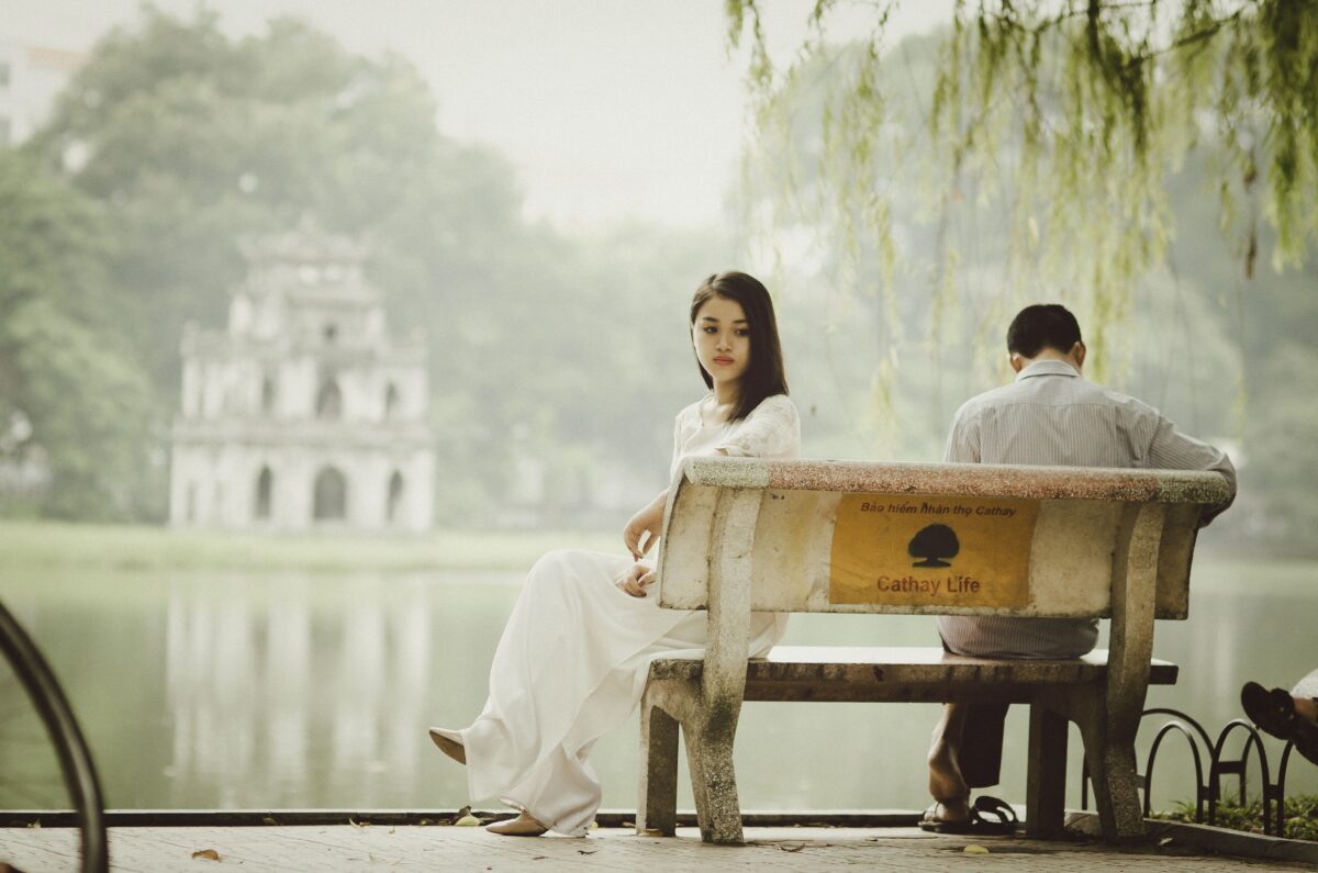 woman-sitting-on-bench-outdoors