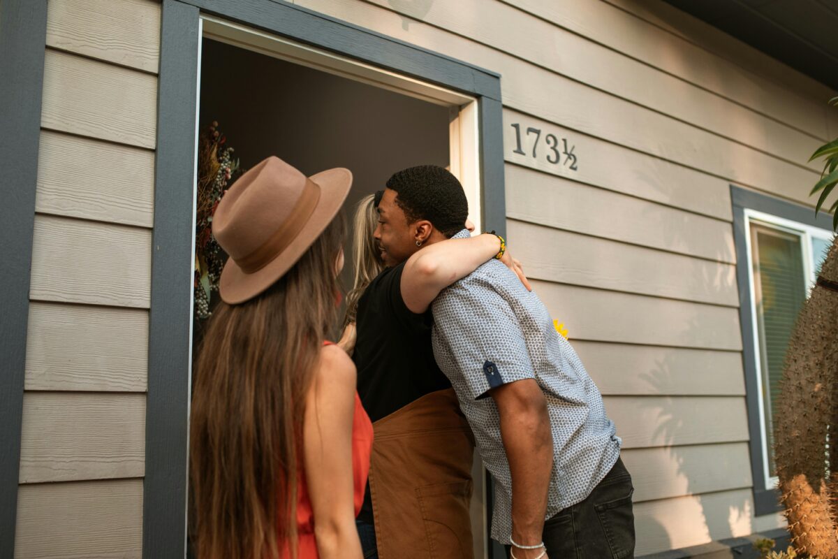a-person-hugging-a-man-at-the-doorway