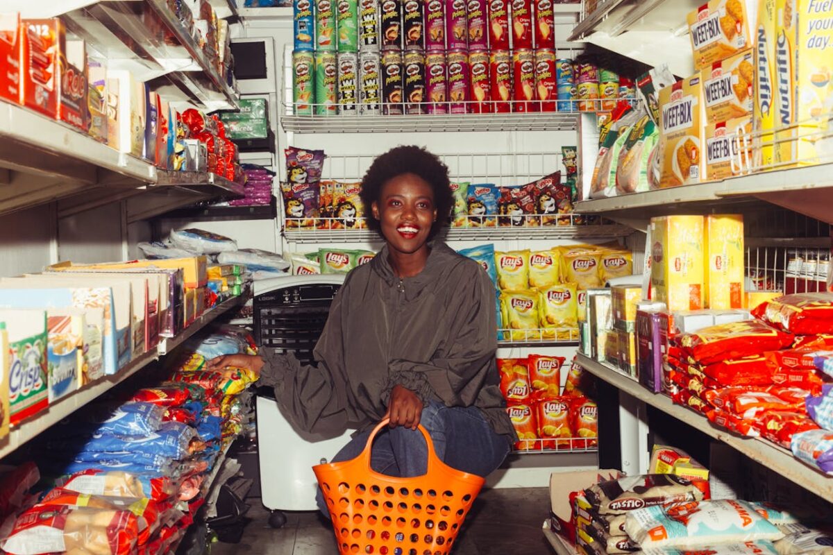 happy-woman-buying-groceries-in-a-convenience-store