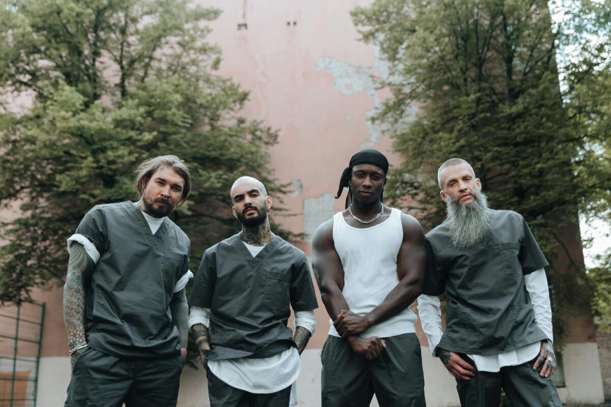 men-standing-in-prison