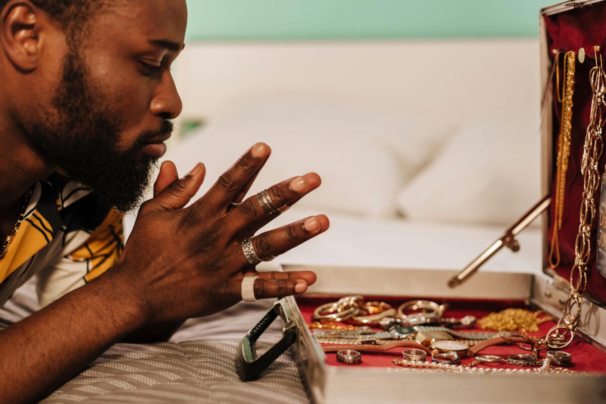 man-in-white-and-yellow-shirt-with-silver-ring