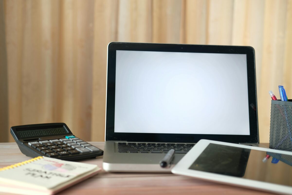 12 Purchases Americans Regret Most During Tough Economic Times 1 laptop-and-calculator-on-top-of-a-table