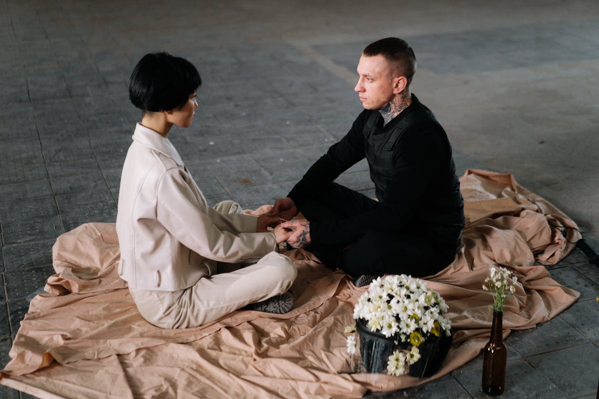 Two individuals having a calm interaction indoors, fostering connection and understanding.