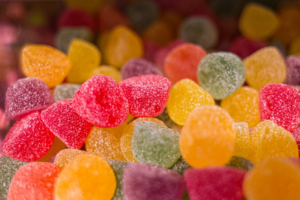 12 Period Mistakes That Are Making Your Cycle Worse Without You Realizing 1 Vibrant close-up of sugar-coated gumdrops showcasing colorful sweet treats.
