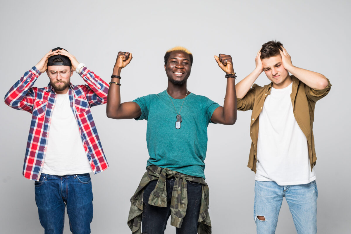 Three young men fans suporters with different emotions isolated on white background