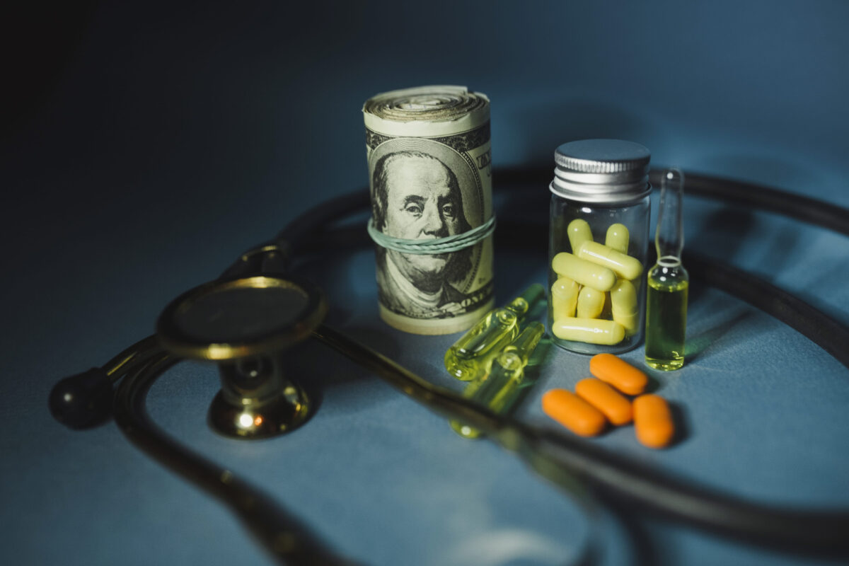 Medicine pills or capsules with money, dollar. Medical or pharmacy prescription for health. Business, finance concept. Cost of the healthy life. Bottle of drug