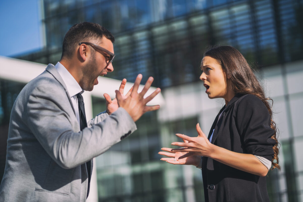 7 Worst Signs of a Weak Man Women Secretly Hate 3 Business colleagues are arguing outside the company building.