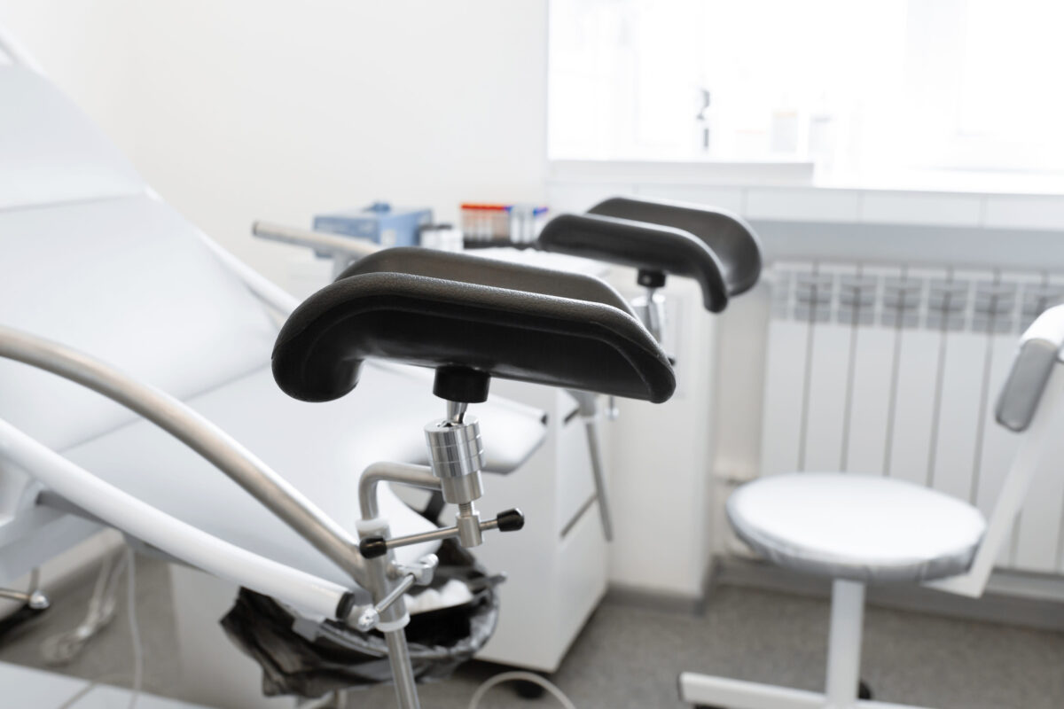 gynecological chair in a light gynecologist's office.