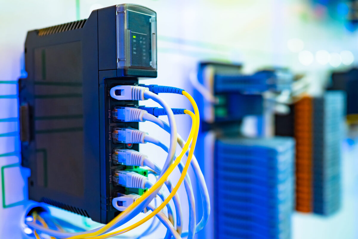 Power supply with white and yellow wires. Cabling. Cables in the connectors. The source of electrical power. Wires connected to power supply. Cables in electrical connectors.
