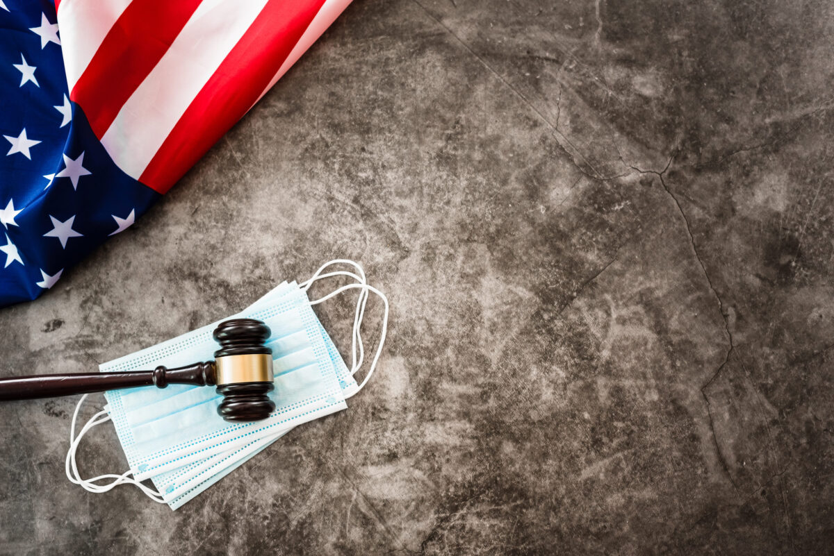 Concept of problems with justice during the covid19 pandemic in america, background with flag.