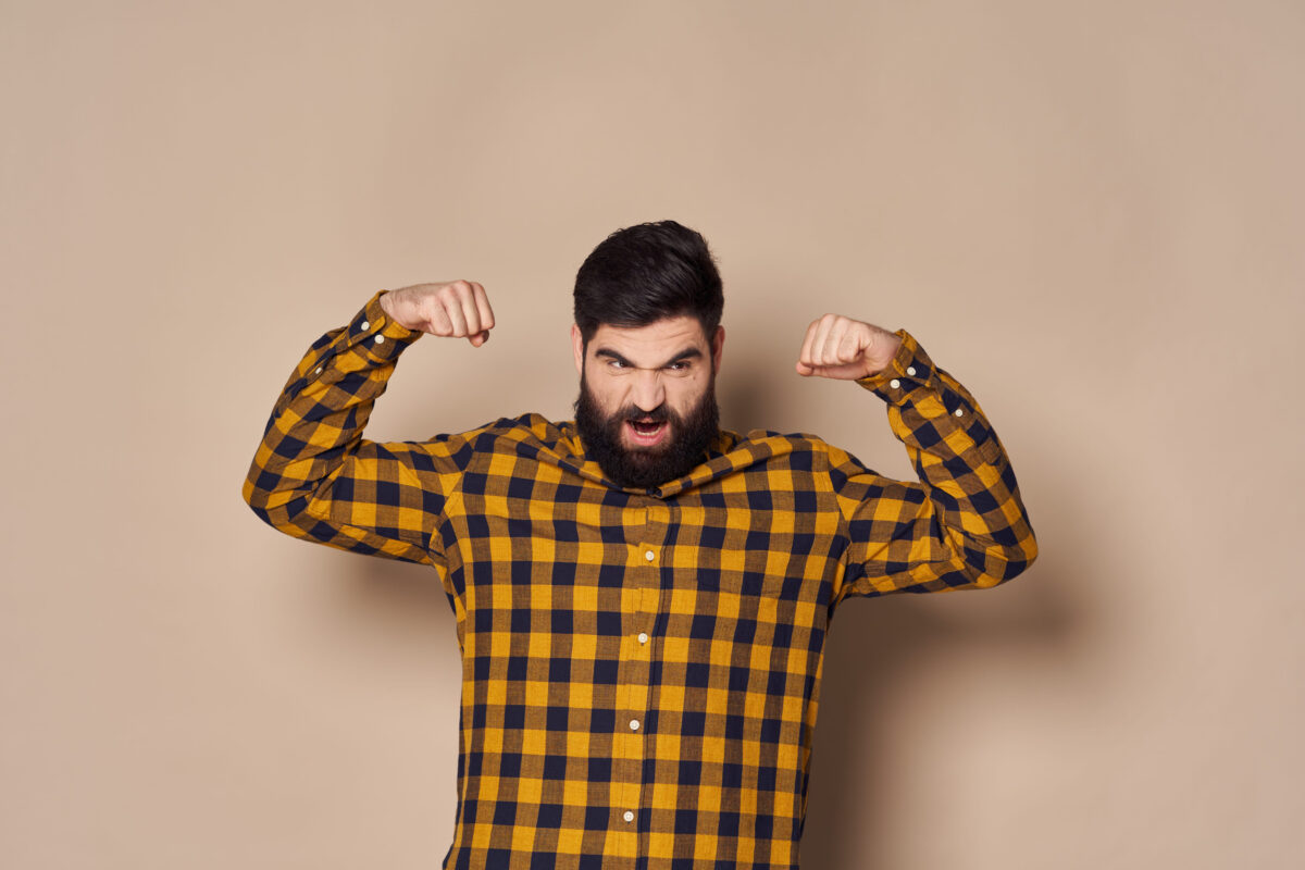 Strong man with a beard and dark hair