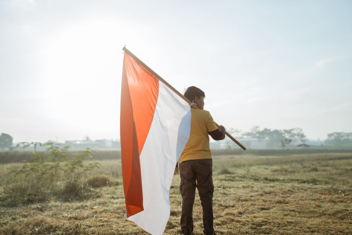 7 Worst Bills Ever Enacted in the United States 2 boy stand while carrying a large Indonesian flag on shoulder