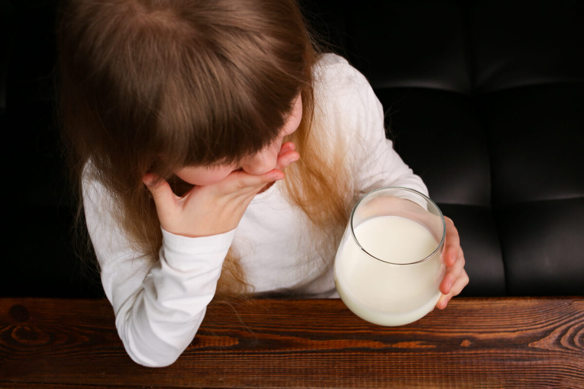 He profits off raw milk that’s making people sick. The government isn’t stopping him. 2 Child girl refuses to drink milk from a glass, covers her mouth with her hand.