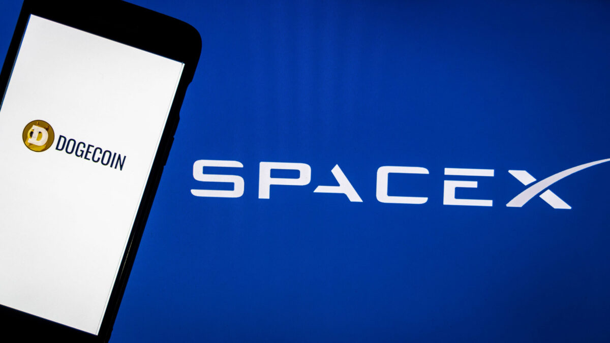 Elon Musk’s Trillion-Dollar Moment Turns SpaceX Into Wall Street’s New Obsession 2 Kathmandu, Nepal - May 11 2021: Dogecoin logo on a smartphone against SpaceX logo in the background. SpaceX accepts Dogecoin as payment to launch aEUR~DOGE-1 mission to the MoonaEUR(TM) next year.