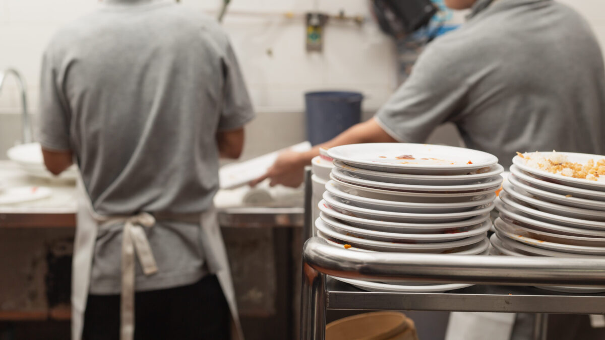 10 Prison Jobs Nobody Wants 1 Man washing dish in sink at restaurant.People are washing the dishes too Cleaning solution
