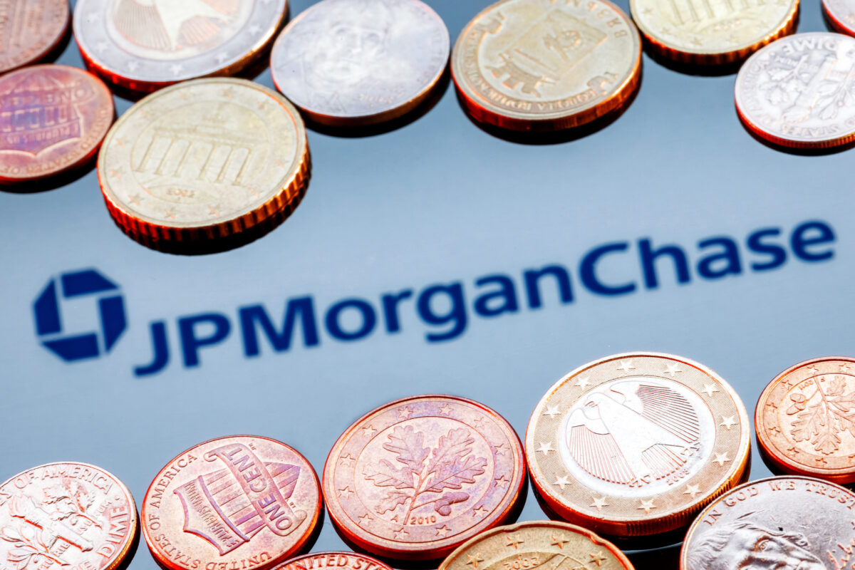 JPMorgan’s Leadership Shakeup Turns Jamie Dimon's Succession Into a Public Test 2 Kazan, Russia - Nov 24, 2021: Variety of metal coins on background of JPMorgan Chase bank logo