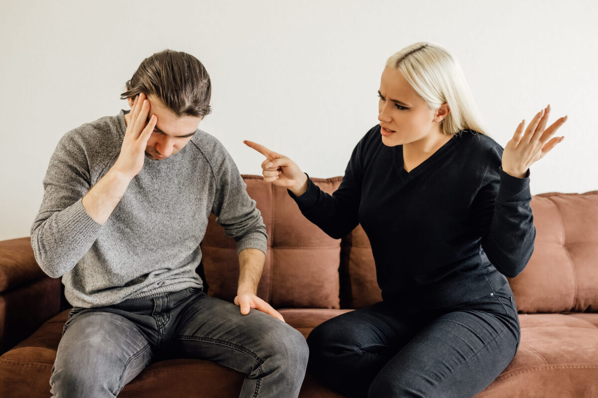 10 Harsh Truths That Prove the Right Relationship Shouldn’t Feel Like a Full-Time Job 2 Aggressive caucasian wife Shouting At Unhappy Victimized Husband Sitting On Couch At Home. Family Conflicts, Quarrels And Domestic Violence, Marriage And Relationship Crisis Concept. Selective Focus