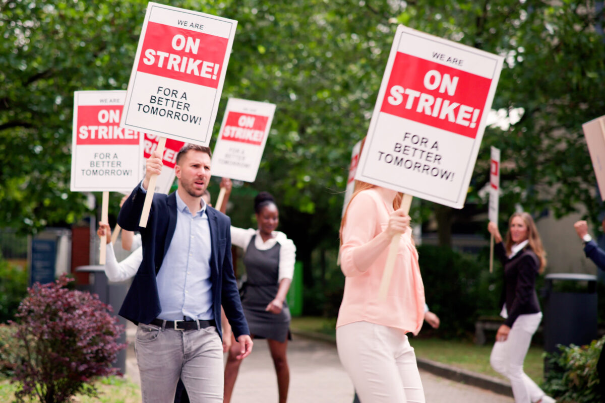 Workers Strike Demonstration In City. Labor Union March. Protest Rally