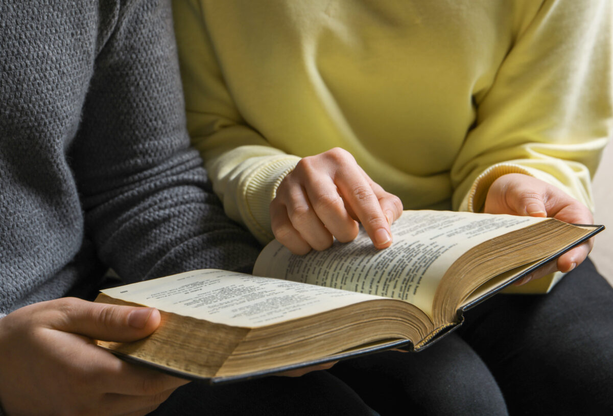 7 Ways to Break Free from the Pressure to Be a Perfect Christian 2 couple sitting and reading holy bible, closeup