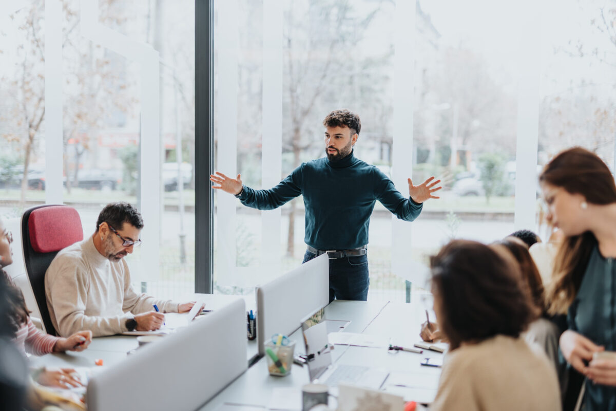 Confident successful multigenerational team of diverse businesspeople working together in a modern office