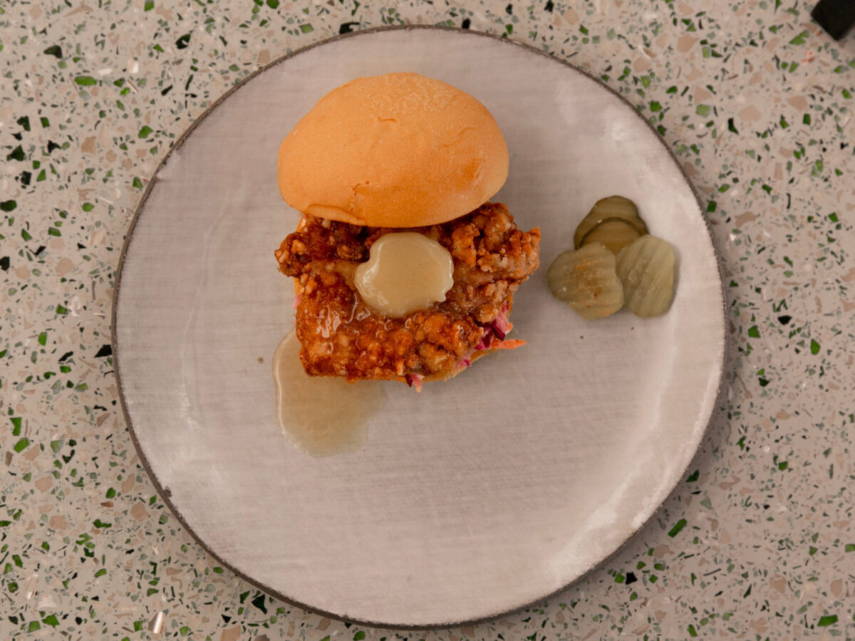 8 Unhealthiest Fast-Food Chicken Sandwiches, Ranked 4 Hamburger with minced meat and pickled cucumber on a plate