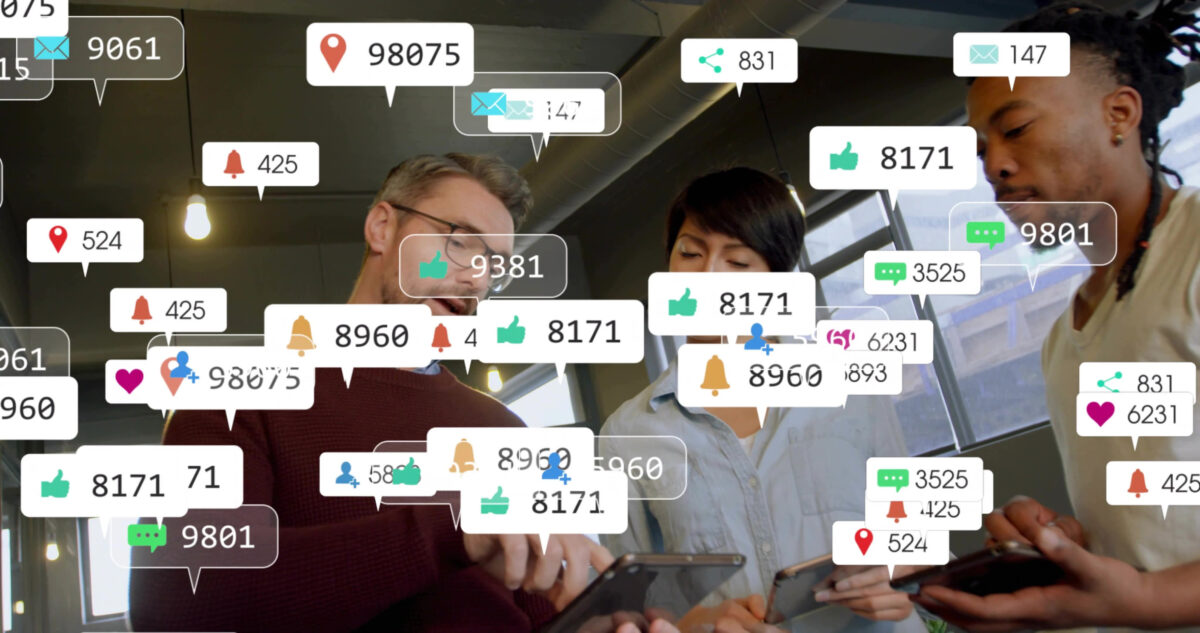 11 Reasons Why Viral Recipes Fail And How We Waste Ingredients 1 Standing three coworkers wearing maroon examining smartphones, tablet in office, notifications. Trio, colleagues, collaboration, devices, daylight, workspace, modern