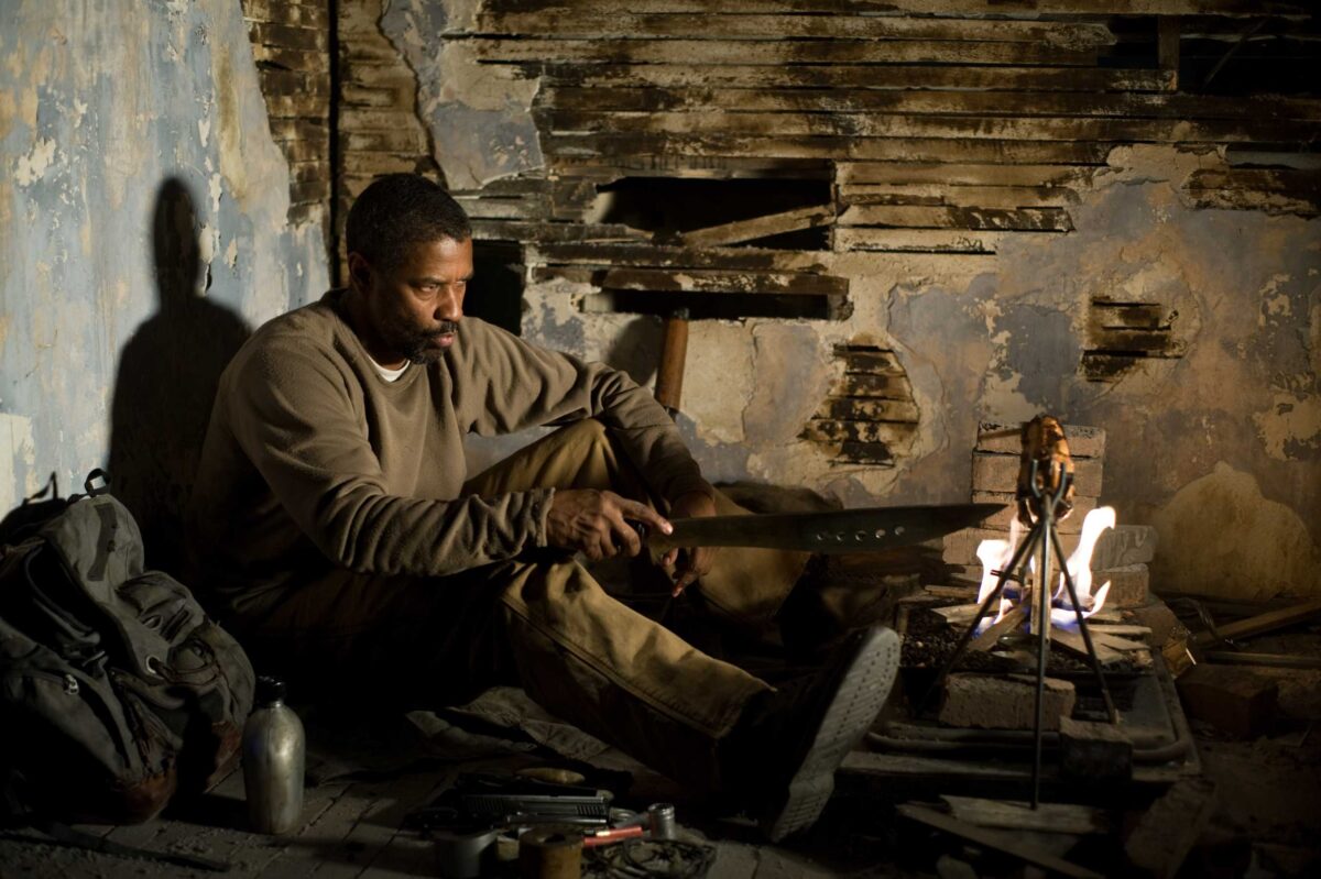 A man holding a long  knife