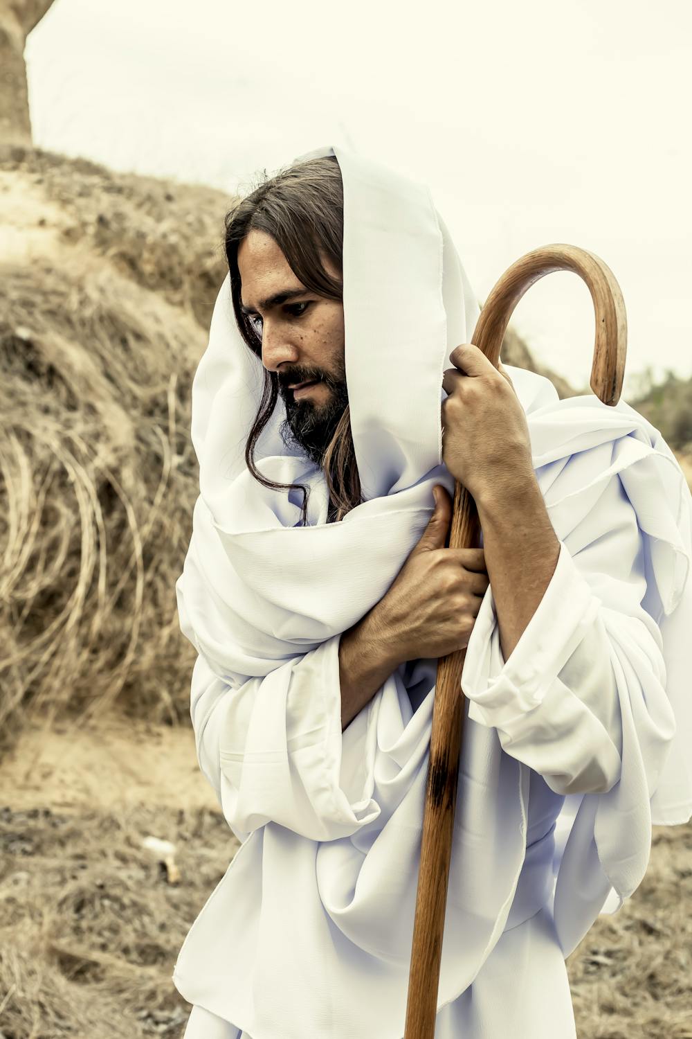 10 Truths Behind the Bloody Sign God Gave Abraham 1 A contemplative shepherd in white robe holding a staff outdoors.