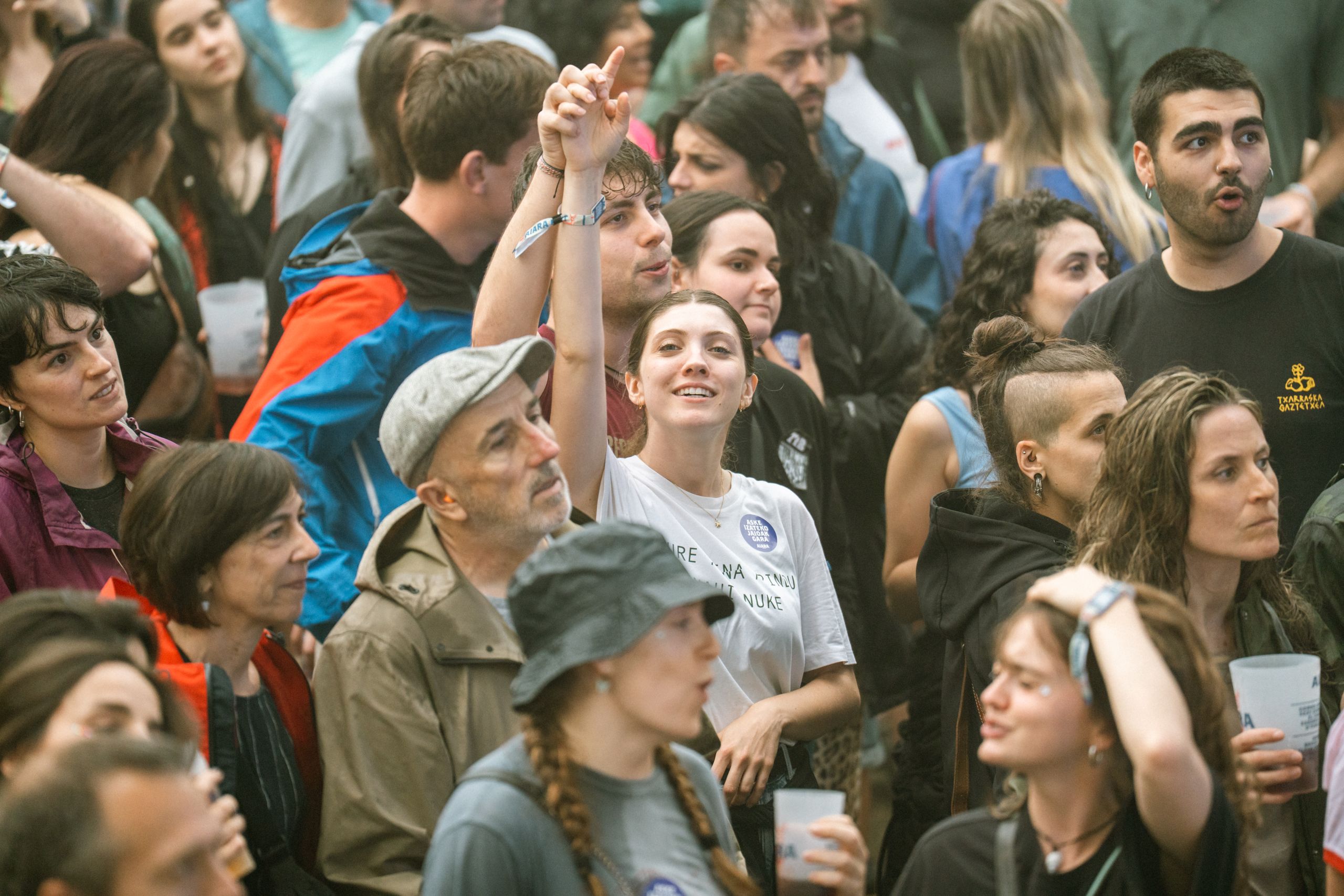Trump Said Italy’s Prime Minister Begged for a Photo. Her Response Turned It Into a Diplomatic Mess 2 A diverse crowd enjoying an outdoor festival with various expressions and interactions.