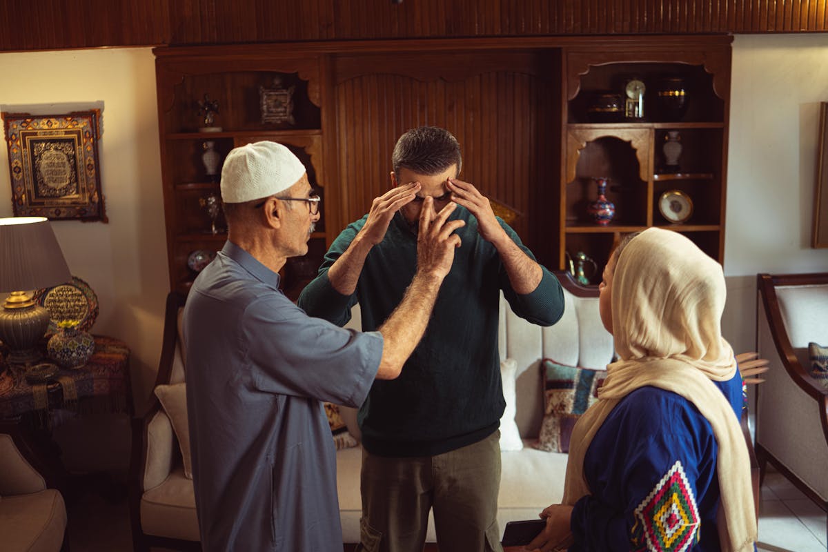A family discussion taking place in an ornate and traditional home environment, showcasing cultural elements.