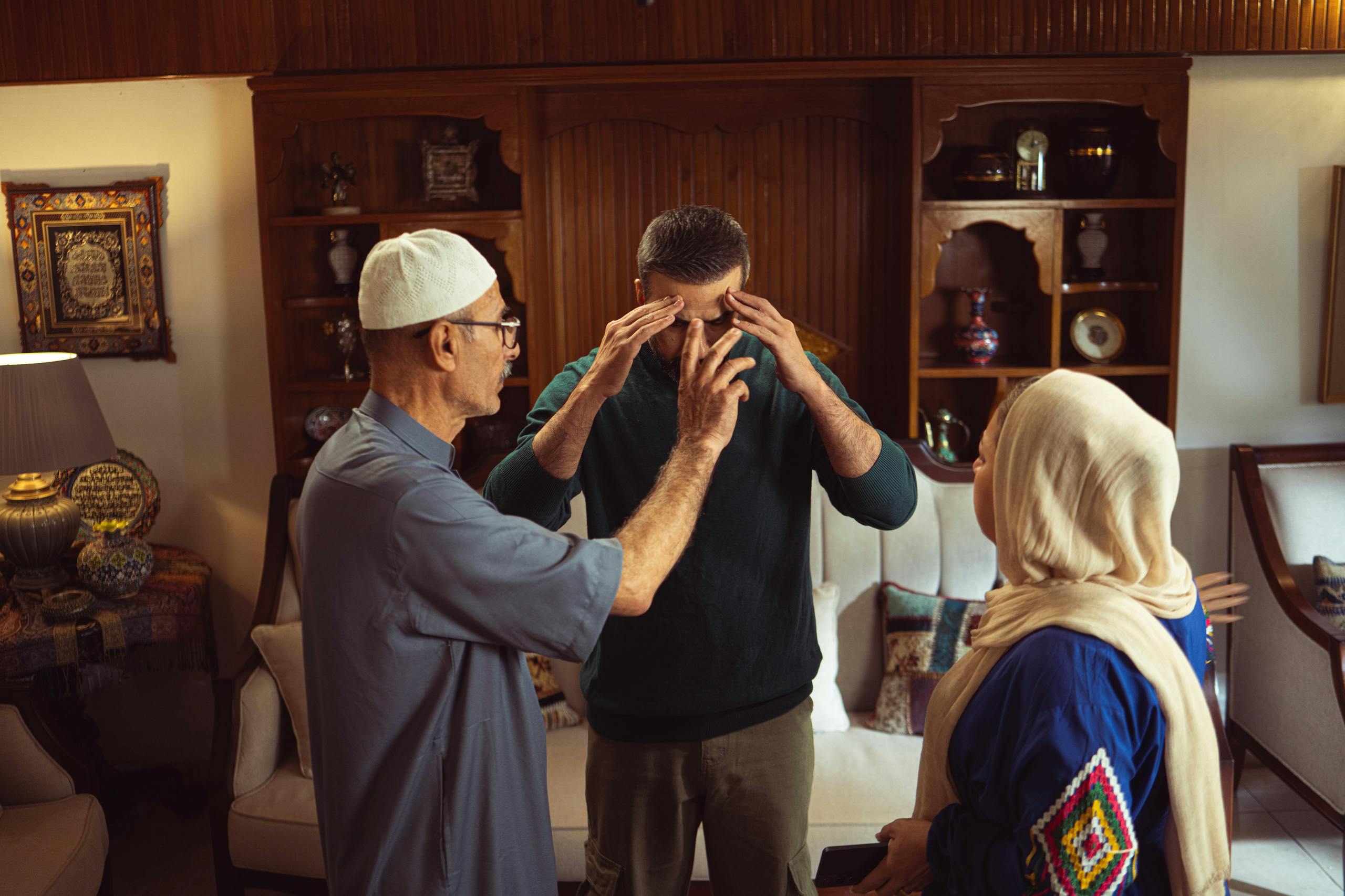 A family discussion taking place in an ornate and traditional home environment, showcasing cultural elements.