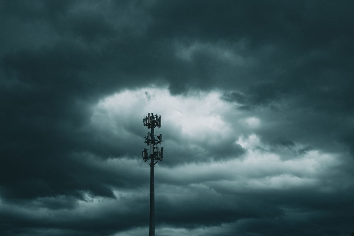 Darkness Killed the Dinosaurs: How a 66-Million-Year-Old Asteroid Starved the Oceans. 1 A lone cell tower stands against a dramatic, cloudy sky, capturing the essence of stormy weather.